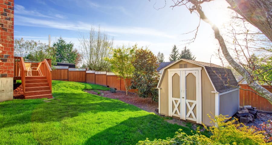 Fenced backyard with storage shed in Shreveport